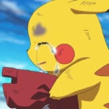 Pikachu crying while holding a hat